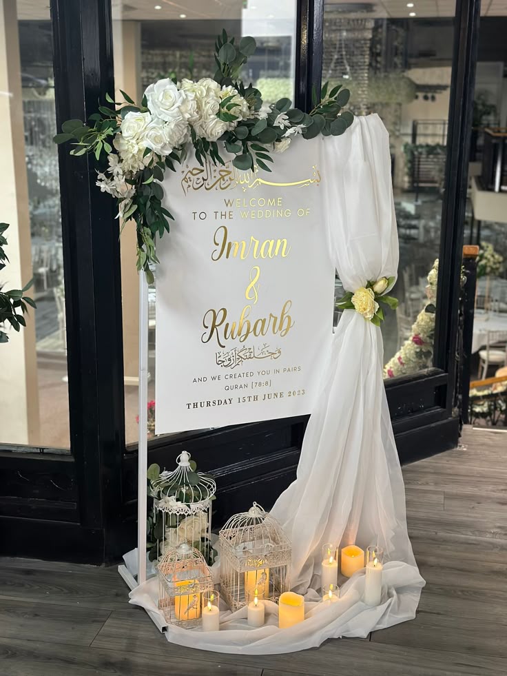 Elegant Wedding Welcome Sign with Floral Decor and Candlelight Accents
