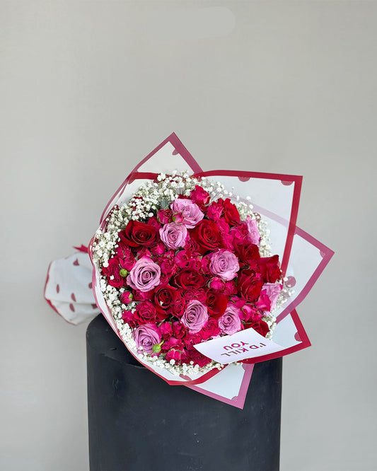 Bold Red and Lavender Rose Bouquet with Babyβs Breath