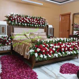 Luxury Red & White Rose Bridal Bed Decoration with Floral Floor Carpet
