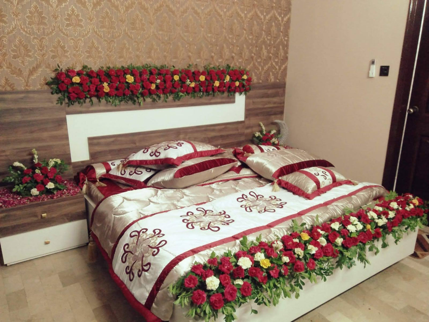 Elegant Bridal Bed Floral Decoration with Red & White Roses