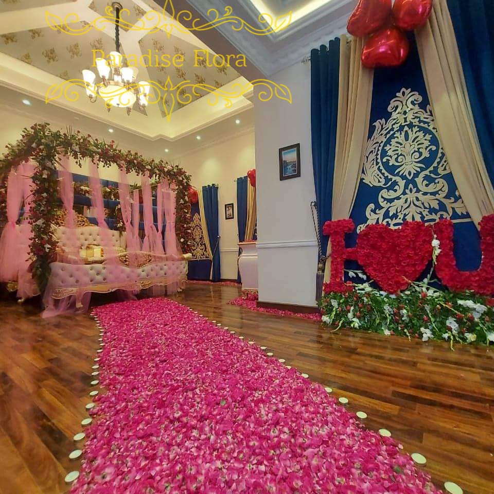 Grand Romantic Bedroom Decor with Rose Petal Path & Floral Bed Canopy