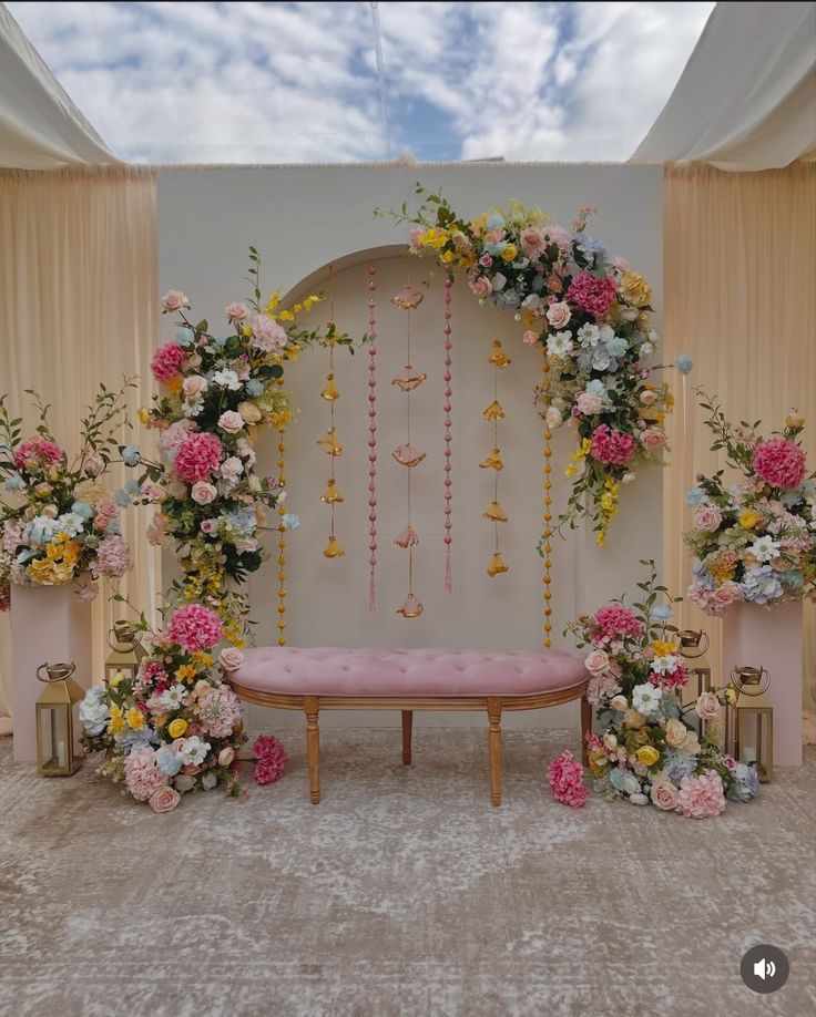 Elegant Pastel Floral Arch Backdrop with Velvet Seating