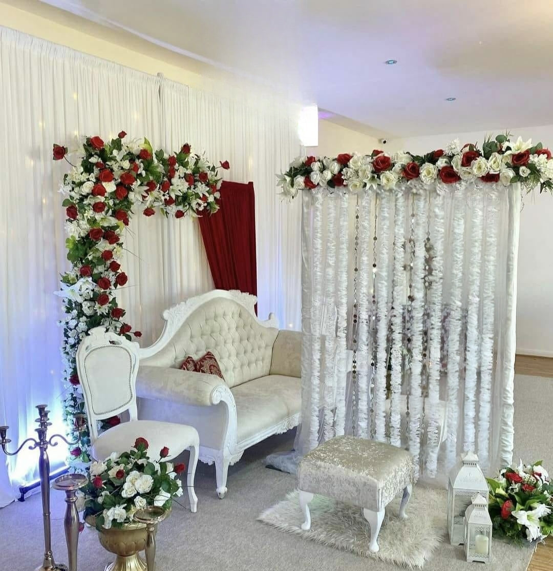 Royal Red and White Floral Stage Backdrop with Tufted Sofa