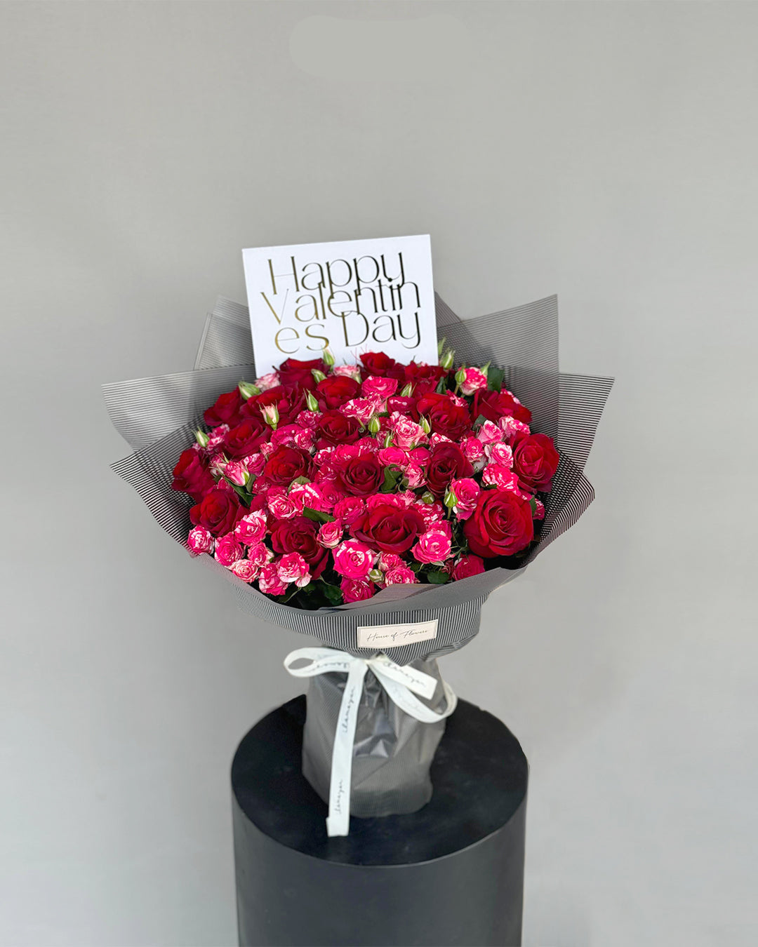 Elegant Red and Pink Spray Rose Bouquet in Grey Wrap