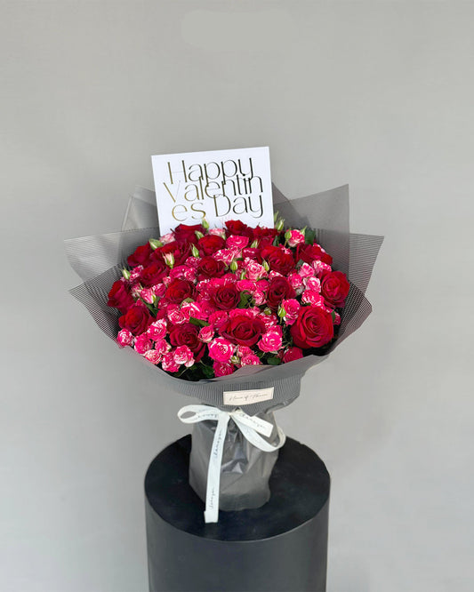 Elegant Red and Pink Spray Rose Bouquet in Grey Wrap