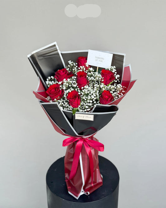 Elegant Red Roses & Baby's Breath Bouquet in Premium Black Wrap
