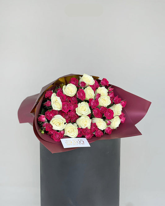 Elegant White Roses & Magenta Spray Rose Bouquet in Burgundy Wrap