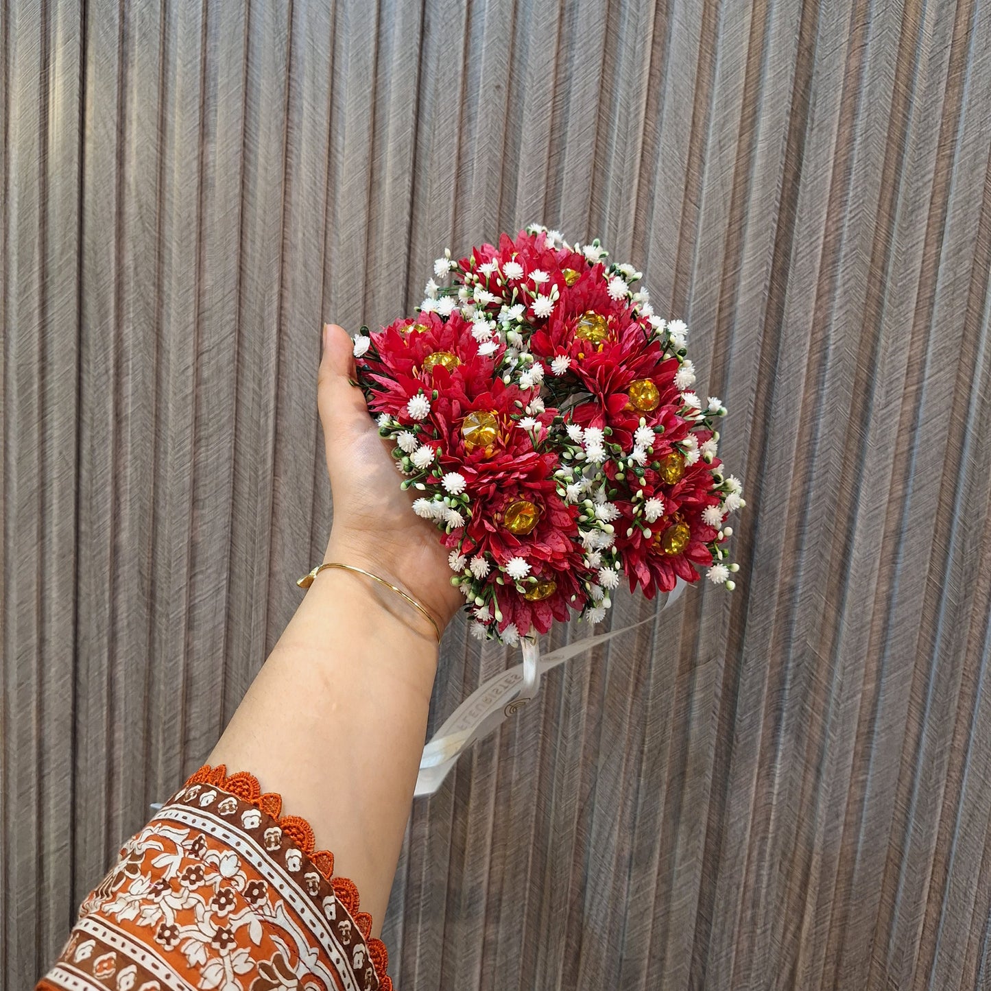 Red Floral Gaira with White Baby’s Breath and Golden Accents